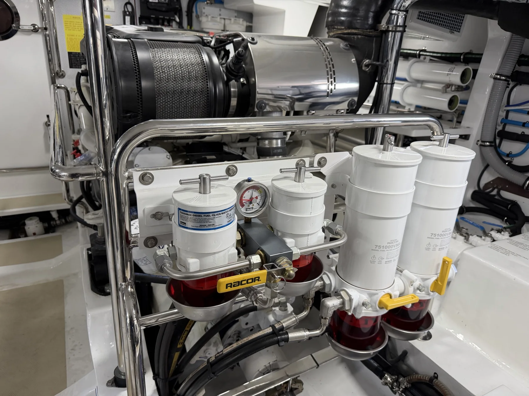 Marine fuel filtration and water-separation manifold installed in an engine room
