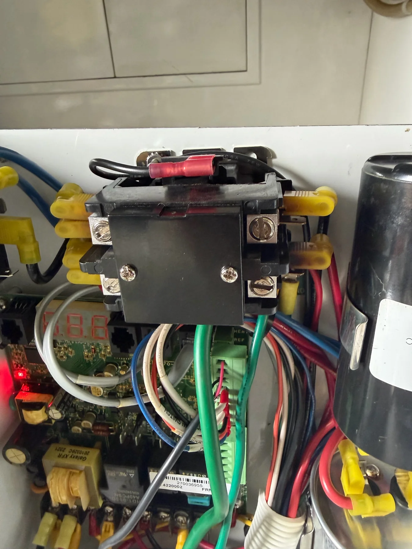 Marine electrical contactor, circuit board, capacitor, and wiring inside an open panel