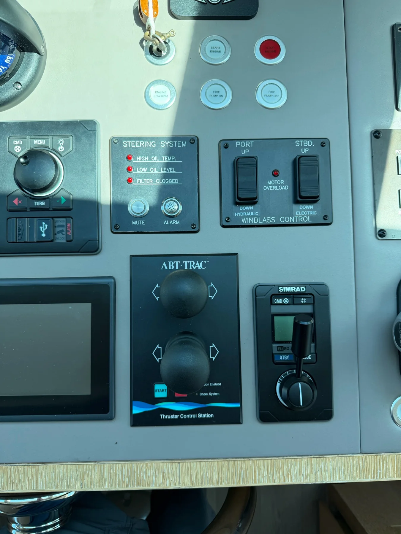Marine helm control station with steering alarms, windlass, thruster, and autopilot controls