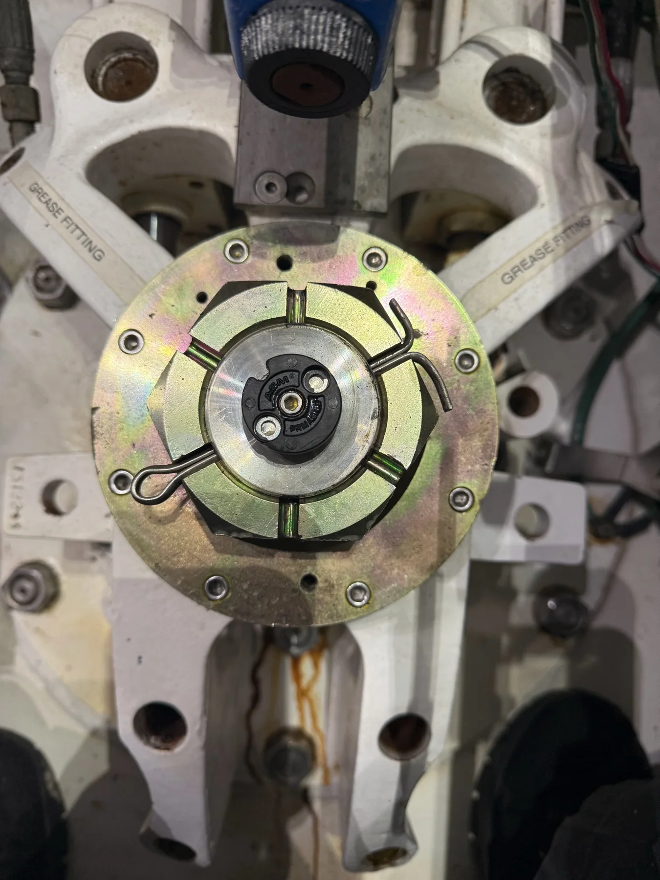 Marine stabilizer actuator hub with retaining hardware and marked grease fittings