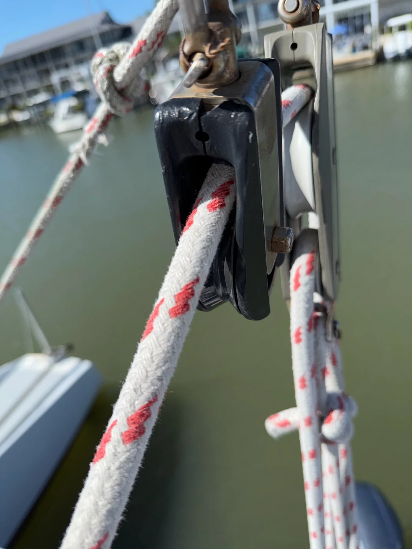 Braided sailboat control line routed through a deck-level block